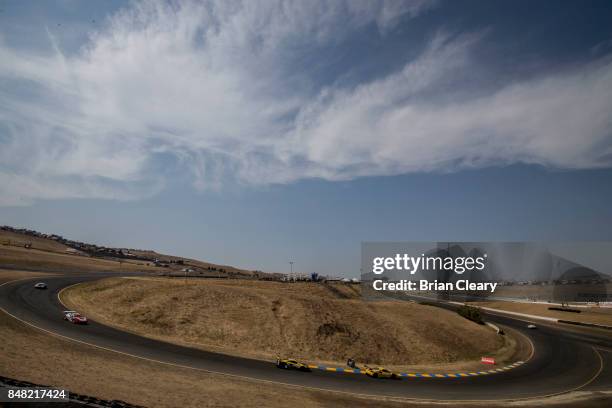 Cars race through a turn during the GoPro Grand Prix of Sonoma Pirelli World Challenge GT race at Sonoma Raceway on September 16, 2017 in Sonoma,...