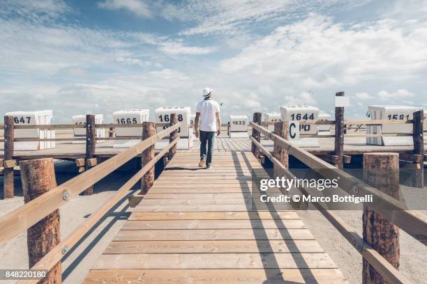 tourist in st. peter-ording, germany. - st peter ording stock pictures, royalty-free photos & images