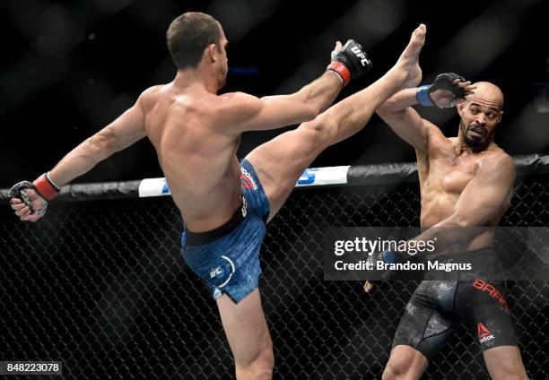 Luke Rockhold kicks David Branch in their middleweight bout during the UFC Fight Night event inside the PPG Paints Arena on September 16, 2017 in...