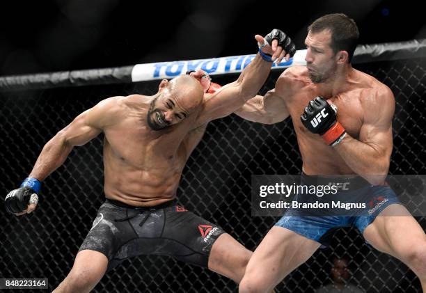 Luke Rockhold punches David Branch in their middleweight bout during the UFC Fight Night event inside the PPG Paints Arena on September 16, 2017 in...