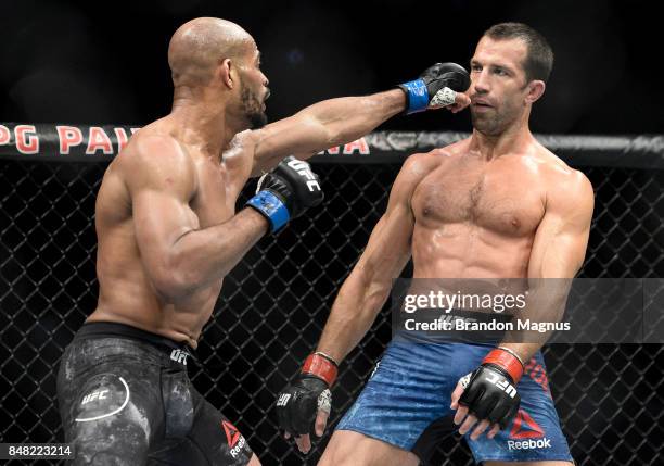 David Branch punches Luke Rockhold in their middleweight bout during the UFC Fight Night event inside the PPG Paints Arena on September 16, 2017 in...