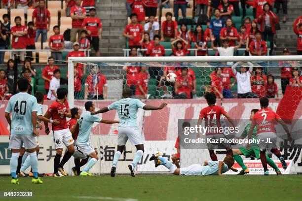 Fozil Musaev of Jubilo Iwata heads the ball to score the opening goal during the J.League J1 match between Jubilo Iwata and Urawa Red Diamonds at...