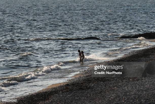 Even families with children went to swimming despite the prohibition. Aftermath of the havarie of the tanker vessel Agia Zoni II which caused a...