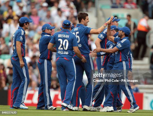 England's Stephen Finn is congratulated on taking the wicket of Australia's David Warner during the One Day International at The Kia Oval, London.