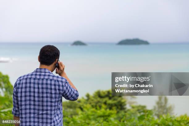 a man at koh chang - call center long shot stock pictures, royalty-free photos & images