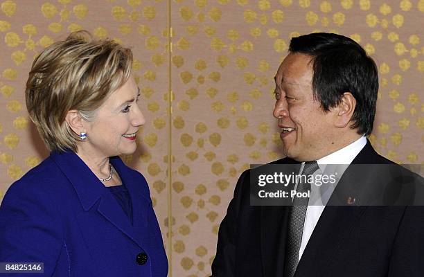 Secretary of State Hillary Clinton and Japanese Minister of Defense Yasukazu Hamada smile prior to their meeting at the Iikura Guest House on...