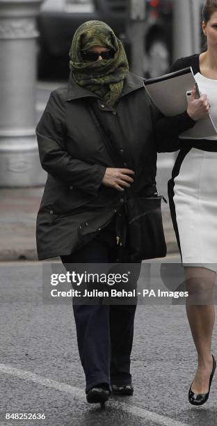 Star Adam Clayton's former personal assistant Carol Hawkins arrives at Circuit Criminal Court in Dublin where she is due to be sentenced for the...