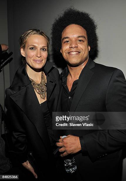 Actress Molly Sims and pianist Eric Lewis attend the Donna Karan Collection Fall 2009 fashion show during Mercedes-Benz Fashion Week at 711 Greenwich...