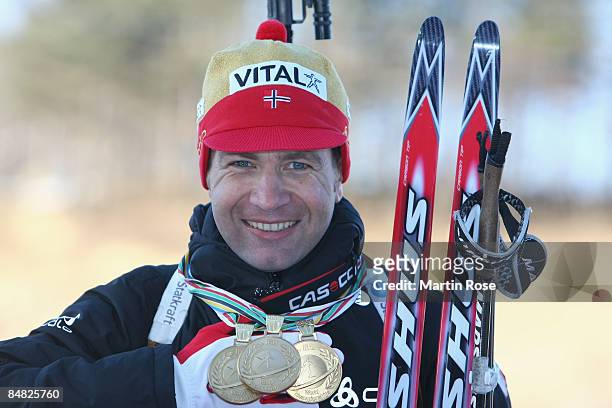 Ole Einar Bjoerndalen of Norway poses with three gold medals after winning the Mens's 20 km individual of the IBU Biathlon World Championships on...