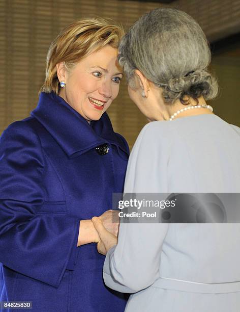 Secretary of State Hillary Rodham Clinton is greeted by Japan's Empress Michiko upon arriving to attend a tea party at Imperial Palace in Tokyo on...