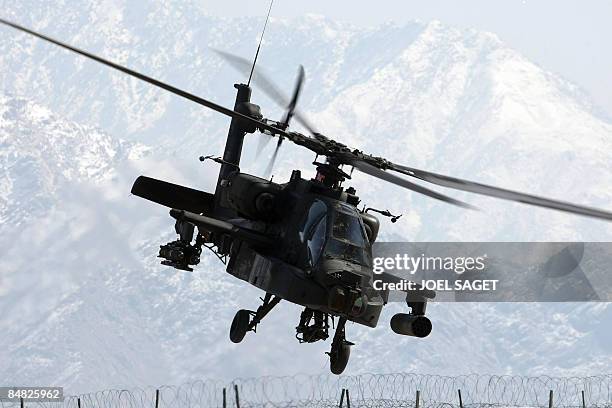 Apache helicopter overfiles FOB Morales-Frazier in Nijrab on February 17, 2009. The deterioration in security in Afghanistan has alarmed its Western...