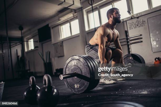 man preparing for a lift - deadlift stock pictures, royalty-free photos & images