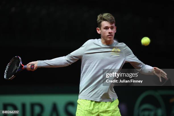 Alex De Minaur of Australia hits with Nick Kyrgios of Australia during day three of the Davis Cup World Group semi final match between Belgium and...