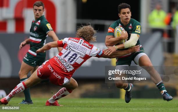 Matt Toomua of Leicester is tackled by Billy Twelvetress during the Aviva Premiership match between Leicester Tigers and Gloucester Rugby at Welford...