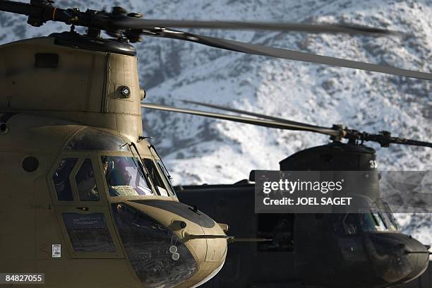 Pair of US Chinook helicopters land at FOB Morales-Frazier in Nijrab on February 17, 2009. The deterioration in security in Afghanistan has alarmed...