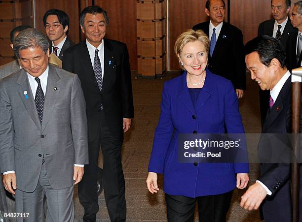 State Secretary Hillary Clinton arrives with Japanese Prime Minister Taro Aso prior to a state dinner ahead of talks at Aso's official residence on...