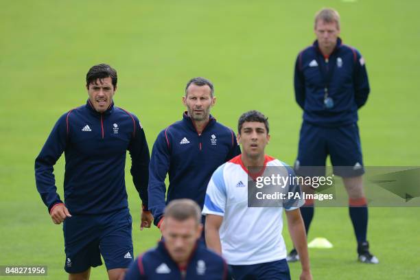 Great Britain coach Stuart Pearce watches over the Welsh contingent of James Tomkins , Ryan Giggs, Neil Taylor and Craig Bellamy during a training...