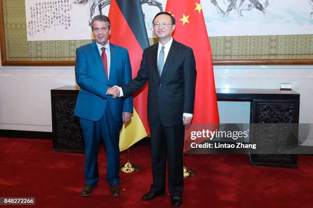 German Foreign Minister and Vice Chancellor Sigmar Gabriel shakes hands with Chinese State Councilor Yang Jiechi before their meeting at Diaoyutai...