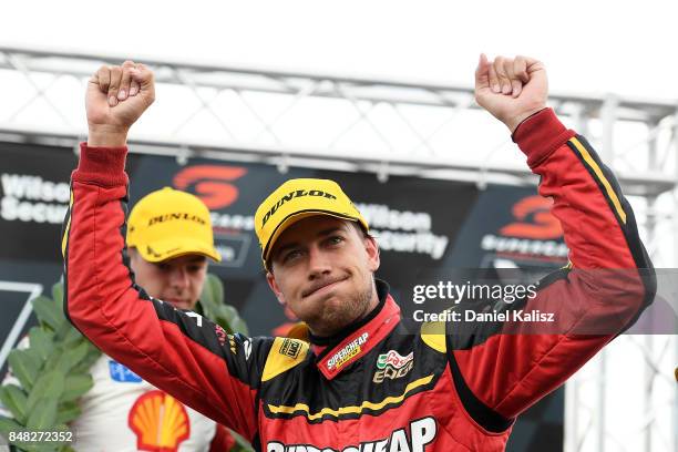 Chaz Mostert driver of the Supercheap Auto Racing Ford Falcon FGX celebrates on the podium after the Sandown 500, which is part of the Supercars...