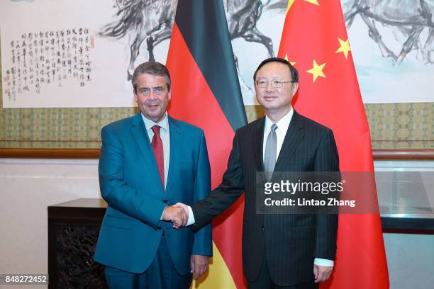 German Foreign Minister and Vice Chancellor Sigmar Gabriel shakes hands with Chinese State Councilor Yang Jiechi before their meeting at Diaoyutai...