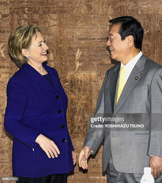 Visiting US Secretary of State Hillary Clinton laughs with Japan's main opposition Democratic Party of Japan leader, Ichiro Ozawa, prior to their...