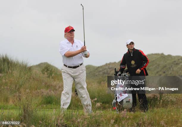 Donald Trump during his round of golf on the Trump International Golf Links golf course near Aberdeen after officially opening it this morning.