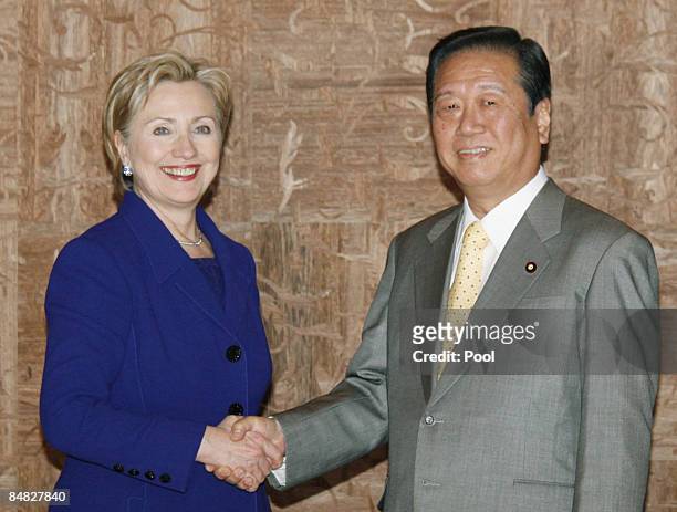 Secretary of State Hillary Clinton speaks to Japan's main opposition Democratic Party of Japan leader Ichiro Ozawa prior to their meeting at a Tokyo...