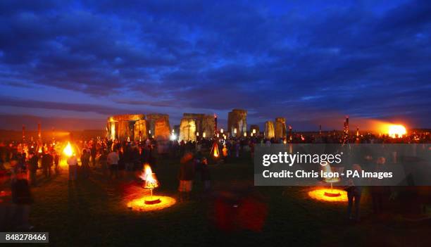 Fires light up the ancient stones at Stonehenge near Salisbury, Wiltshire as French artists Compagnie Carabosse present Fire Garden for the Salisbury...