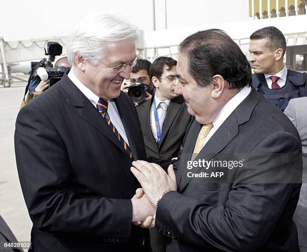 German Foreign Minister Frank-Walter Steinmeier is welcomed by his Iraqi counterpart Hoshyar Zebari after arriving in Baghdad on February 17, 2009....