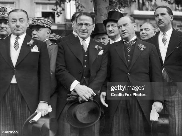 French government ministers at a military parade celebrating the 150th anniversary of the storming of the Bastille, Paris 14th July 1939. Left to...