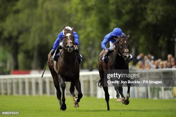 Marshgate Lane ridden by Mickael Barzalona trained by Mahmood Al Zarooni leads the field to win the Equine FX.com Maiden Stakes with Ruwaiyan ridden...