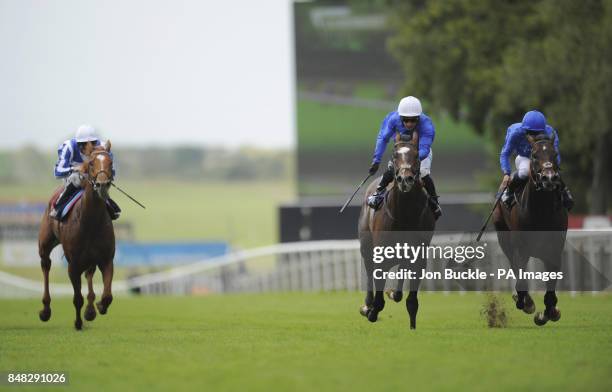 Marshgate Lane ridden by Mickael Barzalona trained by Mahmood Al Zarooni leads the field to win the Equine FX.com Maiden Stakes with Ruwaiyan ridden...