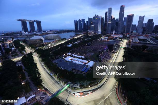 The city skyline over Marina Bay street circuit is seen at dusk before the start of the Formula One Singapore Grand Prix in Singapore on September...