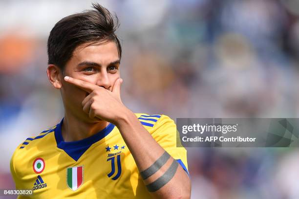 Juventus' Argentinian forward Paulo Dybala celebrates after scoring a goal during the Italian Serie A football match Sassuolo versus Juventus on...