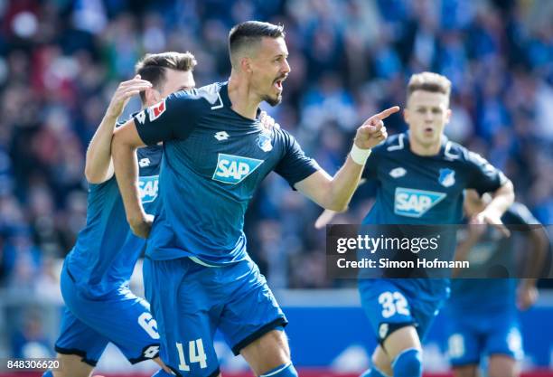 Sandro Wagner of Hoffenheim celebrates his team's first goal with team mate Havard Nordtveit during the Bundesliga match between TSG 1899 Hoffenheim...