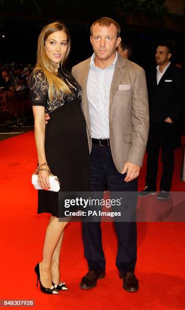 Guy Ritchie and Jacqui Ainsley arrive at the premiere of the new Batman film, The Dark Knight Rises at the BFI Imax Theatre, Waterloo, London.