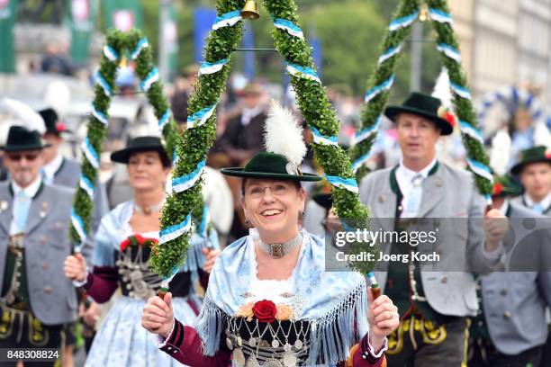 Performers in traditional Bavarian costumes march over Munich's famous Ludwigstrasse during the traditional Costume and Riflemen's Procession at day...