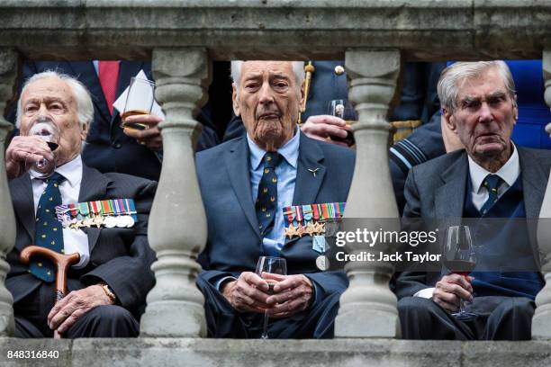 Veterans gather on a balcony opposite Westminster Abbey to watch a flypast following a service to mark the 77th anniversary of the Battle of Britain...