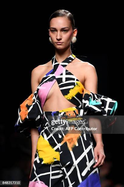 Model presents a creation of Maria Escote's Spring/Summer 2018 collection during the Madrid Fashion Week in Madrid on September 17, 2017. / AFP PHOTO...