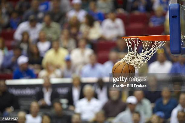 Closeup of ball going through rim and net, equipment during Orlando Magic vs Denver Nuggets game. Orlando, FL 2/11/2009 CREDIT: Bill Frakes