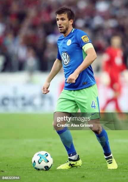 Ignacio Camacho of Wolfsburg controls the ball during the Bundesliga match between VfB Stuttgart and VfL Wolfsburg at Mercedes-Benz Arena on...