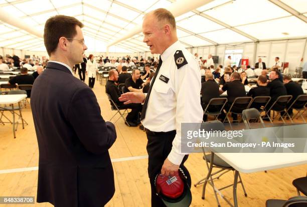 Commander Bob Broadhurst with Security Minister Police James Brokenshire at Battersea Power Station in south London, where police officers are...