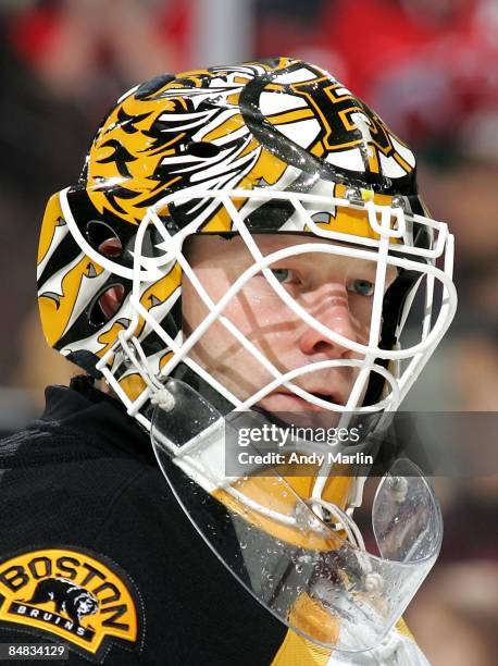 Tim Thomas of the Boston Bruins looks on against the New Jersey Devils at the Prudential Center on February 13, 2009 in Newark, New Jersey. The...