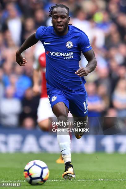 Chelsea's Nigerian midfielder Victor Moses chases the ball during the English Premier League football match between Chelsea and Arsenal at Stamford...