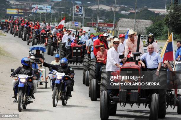 Honduran President Manuel Zelaya , his son and San Pedro Sula's Mayor Rodolfo Padilla , head a convoy of tractors during the handing over of 100...