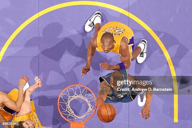 Caron Butler of the Washington Wizards shoots a layup against Kobe Bryant of the Los Angeles Lakers during the game at Staples Center on January 22,...