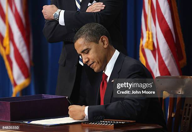 President Barack Obama signs the economic stimulus bill on February 17, 2009 in Denver, Colorado. The $787 billion package will fund infrastructure...