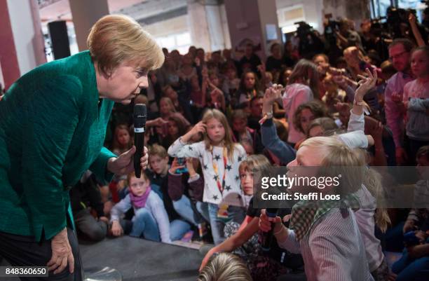 German Chancellor and top candidate of Christian Democrat Union for upcoming federal election Angela Merkel holds a children's press conference at...