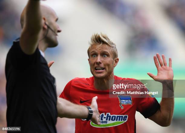 Per Skjelbred of Berlin discusses with the assistant referee during the Bundesliga match between TSG 1899 Hoffenheim and Hertha BSC at Wirsol...