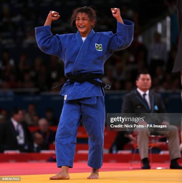 Brazil's Sarah Menezes celebrates her victory in Gold medal contest against Romania's Alina Dumitru during the Women's Judo at the ExCel Arena,...
